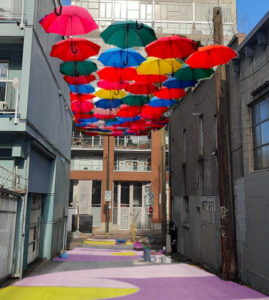 umbrellas over an alley